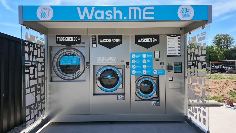 Wash.ME laundry station with washing machines and dryer